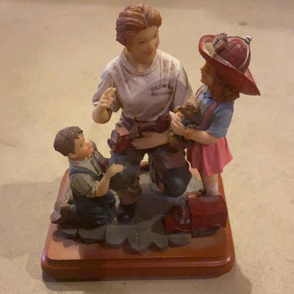 Volunteer woman firefighter statue.